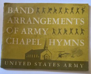 Book with yellow cover and illustrations of marching band and a church.